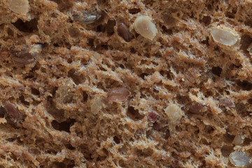 Macro of a bread with seeds, slice
