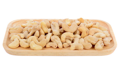 salted cashew nut in wood plate  isolated on white background