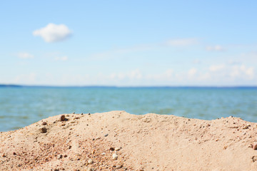 Beach sand and a background of the sky and the sea