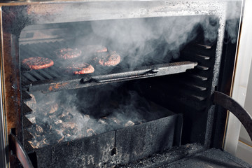 BBQ Grilled Burgers Patties On The Hot Flaming Charcoal Grill, Food, Good Snack For Outdoor Party Or Picnic