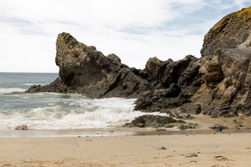 Beach Rocks, Ocean Waves, and Sand Scenery