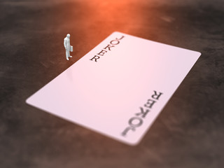 A business figure looking at a pictureless Joker card