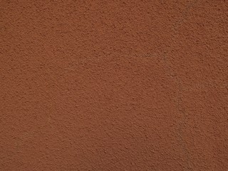 茶色いモルタルの壁