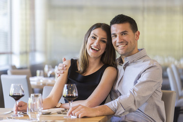 happy young couple in a restaurant