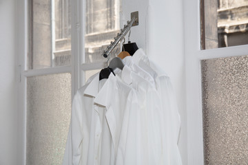 White shirts ready to be tried in a textile store