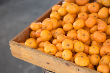 Orange on a wooden box,fruit is sold in the market.