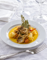 Goat stew with potatoes, thyme and bay leaves.