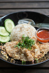 fried pork with fried rice and garlic