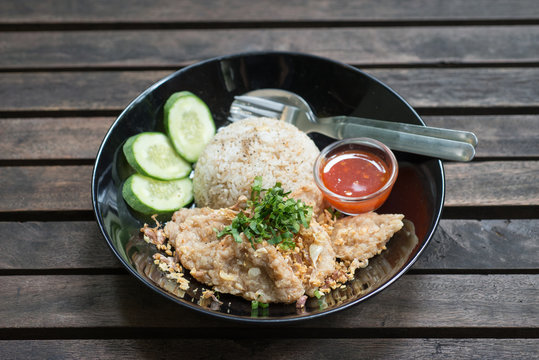 fried pork with fried rice and garlic