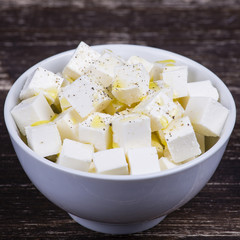 White greek cheese in plate on the table.