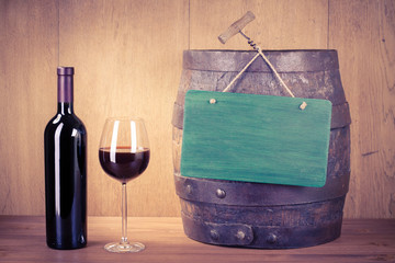 Wine glass, bottle, old wooden barrel sign board