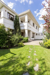White house with huge garden