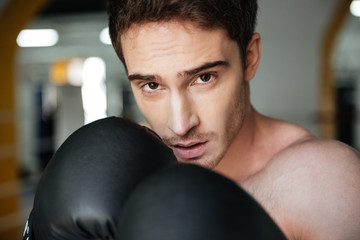 Portrait of confident boxer on ring