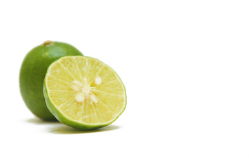 fresh green lime over white background