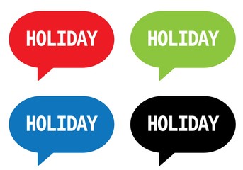 HOLIDAY text, on rectangle speech bubble sign.