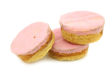 Traditional Dutch pink glazed cakes on a white background