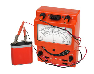 Analog vintage multimeter with battery isolated on white
