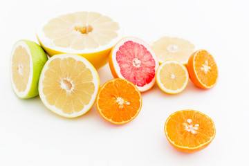 Food pattern of fresh juicy citrus on white background. Flat lay, top view.