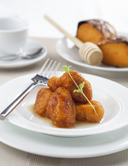 Sweet potato beignets covered with honey