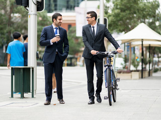 Young businessmen with a bike