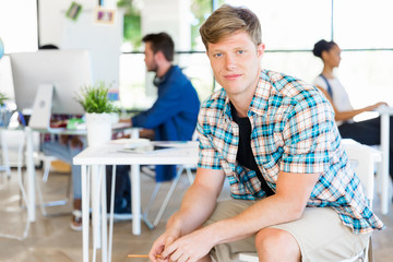 Obraz premium Young man working in office