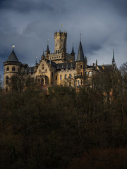 Obraz premium Dark dramatic landscape with Marienburg castle