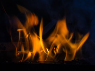 Flame and smoke of fire on a black background closeup