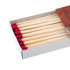 Part of matchbox full of wooden matches with red sulfur isolated on white background