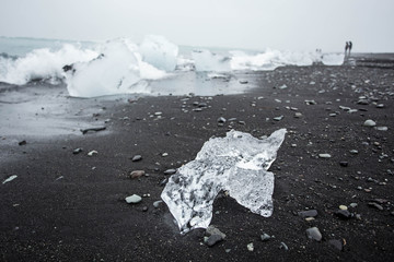 Big cristal ice blocks at black beach in Iceland, Jokursarlon.