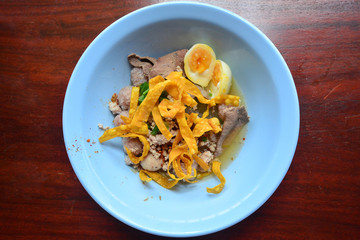 Spicy egg noodle with egg and red roast pork