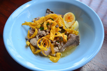 Spicy egg noodle with egg and red roast pork