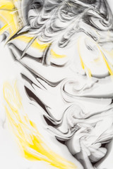 Defocused abstract background with a predominance of yellow and black colors, art abstraction