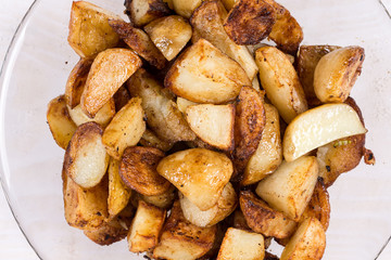 Macro closeup fried young potatoes with blurred background