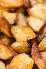 Macro closeup fried young potatoes with blurred background