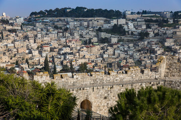  Jerusalem, view on the wall of the old city on sunny day with blue sky. Capital of Israel. Israel landmark. Travel and vacation concept.