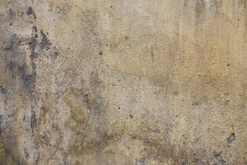 Grunge yellow concrete cement wall background texture.