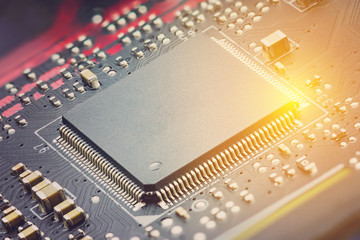 Closeup view of a central processing unit or CPU on electronic board. CPU is electronic circuit within a computer that caries out the instructions of a computer program by performing basic arithmetic.