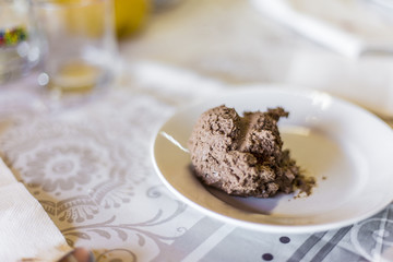 Chocolate ice cream ball served on a white plate