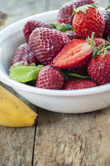 strawberry banana fruits on wood table