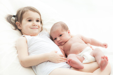 Fototapeta na wymiar elder sister with the newborn child