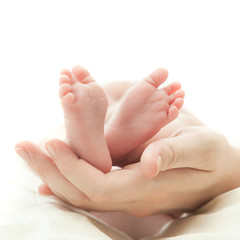 the mother's hand holds legs