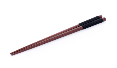 Wooden pairs of chopsticks on white background