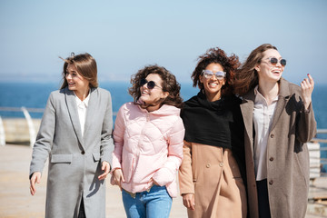 Friends looking away near sea