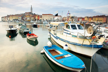 Fototapeta na wymiar Boats dock and marina with reflection at harbor