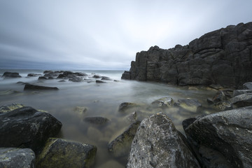 Fototapeta na wymiar View of seacoast with cliffs.