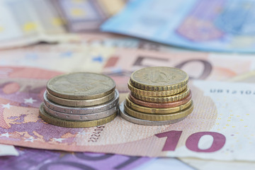 money concept/euro paper currency and coins close up
