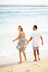 Happy Couple Walking on Seaside in Summer