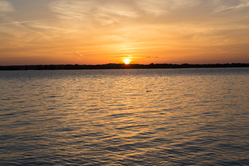 Sunset in lake at Martin Dies state park, Texas