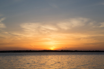 Sunset in lake at Martin Dies state park, Texas