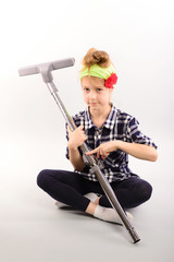 Fototapeta premium Little girl doing housework, isolated photo on white background